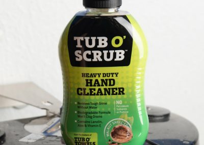 Tub O' Scrub botton on a lid